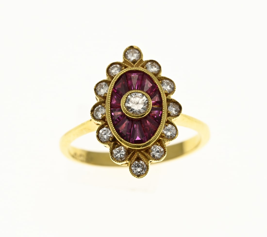 Gold ring with ruby and diamond: Elegant yellow gold ring, 750/000, with ruby and diamond. Ring with an oval head, in the middle with a brilliant cut diamond, approx. 0.10 crt, in a yellow gold smooth setting. Around the diamond is