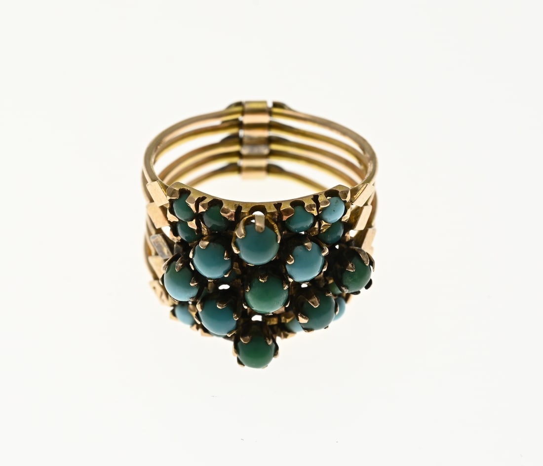 Gold ring with turquoise: Yellow gold ring, 585/000, with turquoise. Ring made of five rings, connected to each other, and set with round cabochon turquoise stones. Width 15 mm. ø 52-53. approx. 5.9 grams. in good condition.