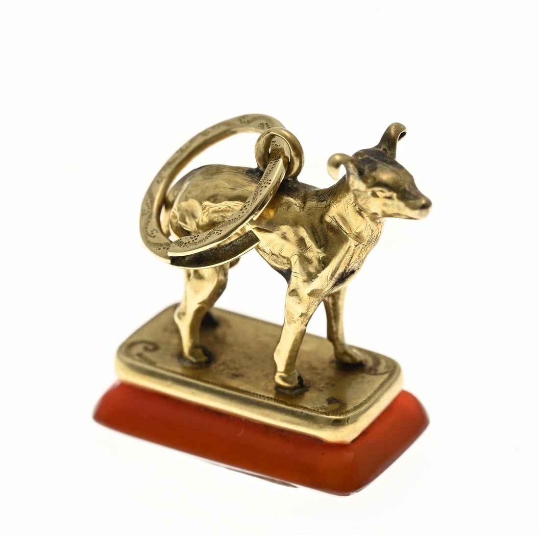 Sealing wax stamp with gold, dog: Gold signet, 585/000, with a dog, standing on an agate stone. 3x1,8x1cm. approx. 4,2 grams. In good condition.