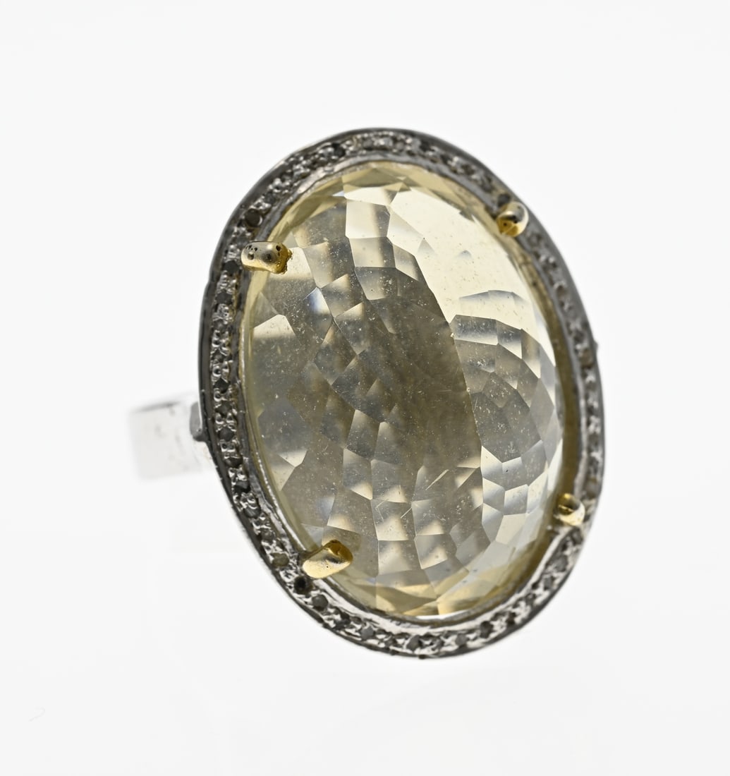 Silver ring (gemstone/diamond): Silver ring, 925/000, with citrine and diamond. Ring with a large head with an oval finely faceted citrine stone surrounded by a rim with various small diamonds. Size head 28x23mm. ø 56. approx.