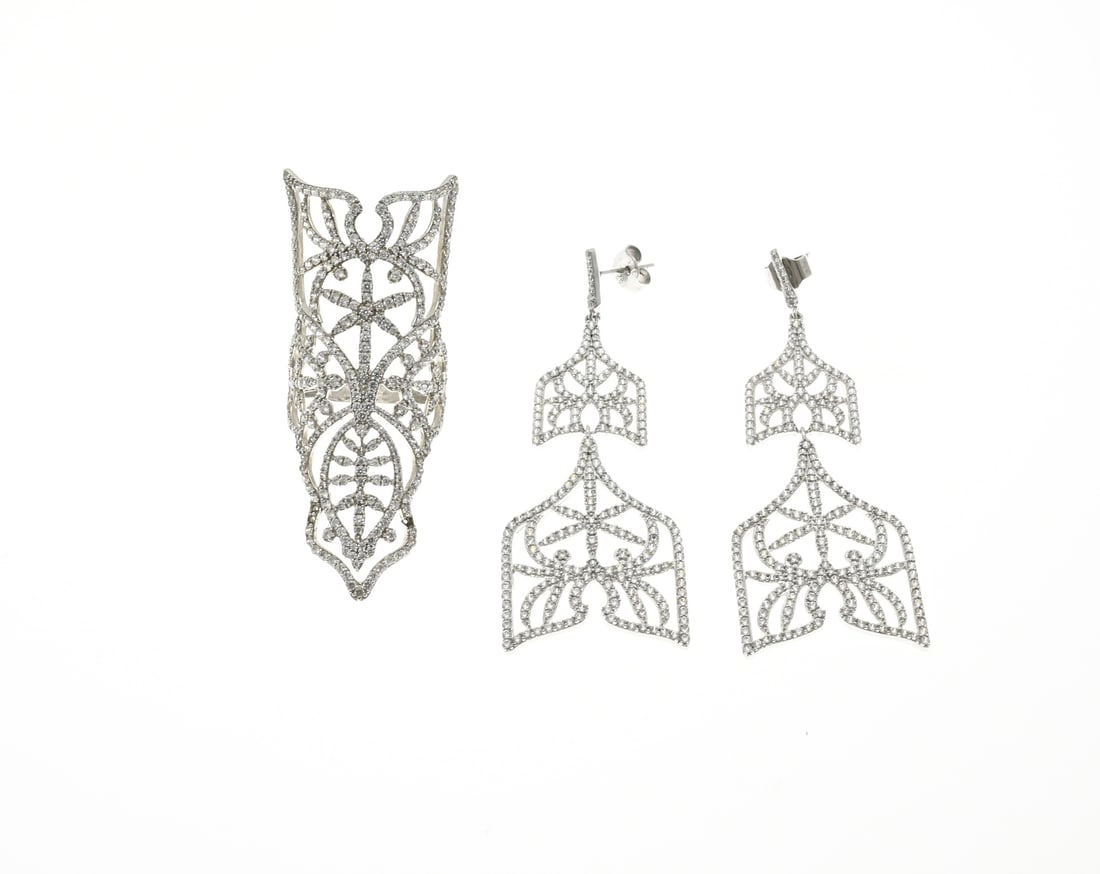 Silver ring with earrings: Silver ring and earrings, 925/000, with zirconia. Ring and earrings, large openwork oriental model completely set with zirconia. 57 mm. ø 55. total approx. 17.8 grams. As new.