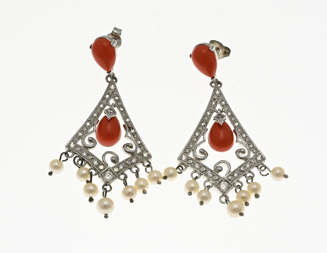 Silver earrings with zirconia and pearls: Silver earrings, 925/000, with zirconia and red beads. Earrings with a diamond-shaped openwork pendant decorated with a rim with zirconia. The pendants have pearls. The plug and the inside of the