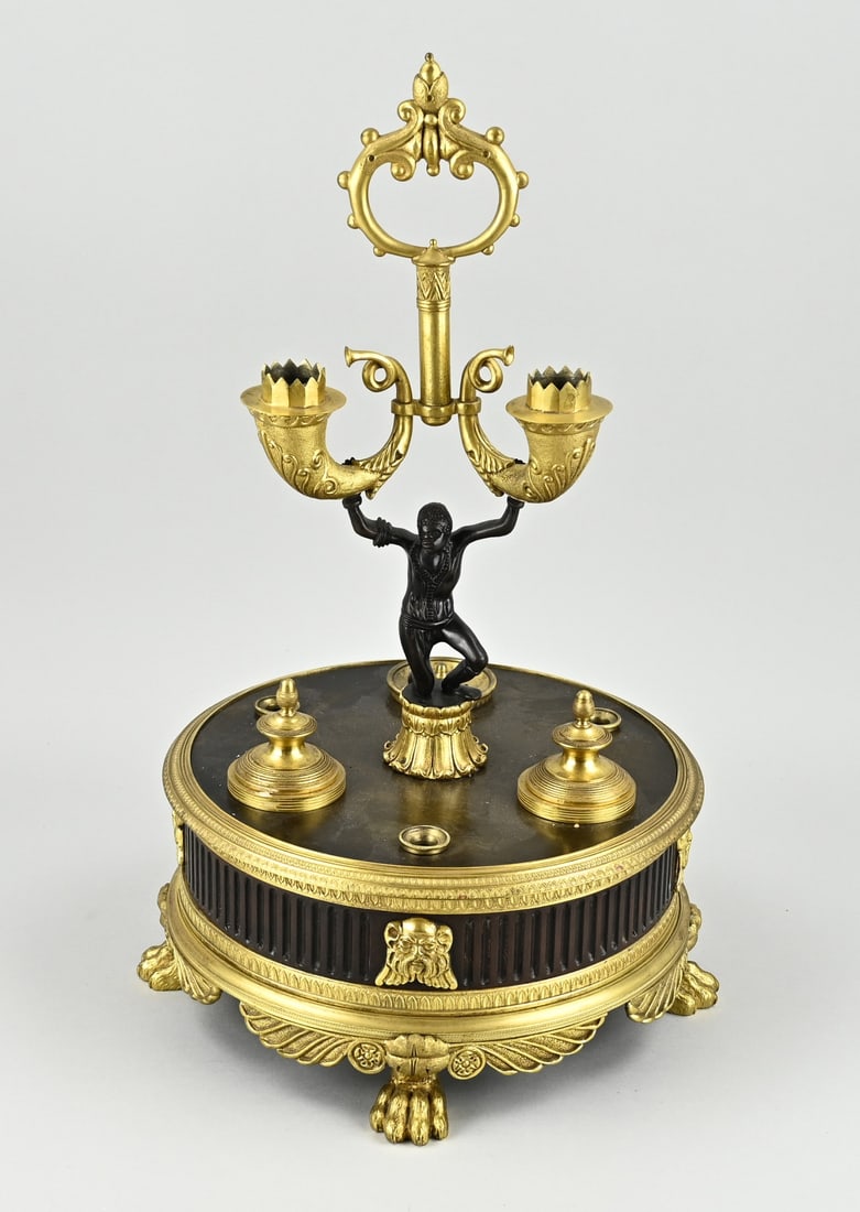 Inkstand, 1820: Rare large bronze, partly fire-gilded empire inkstand with figure + candlesticks. Circa 1820. Dimensions: 46 x Ø 25 cm. In good condition.