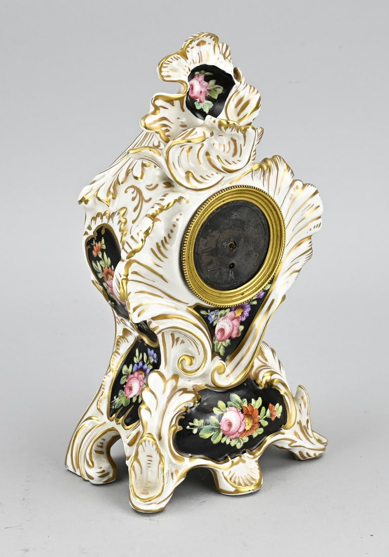 French porcelain clock, 1840: French Charles Dix porcelain clock with pocket watch movement. Debelle a Paris. Circa 1840. Verge escapement movement good. Missing hands. Size: H 25 cm. In reasonable condition.