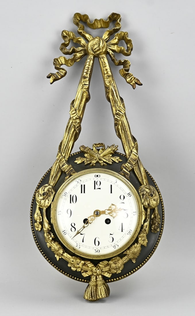 Wall Cartel clock, 55 cm.: 19th Century French, bronze gilt wall Cartel clock in Louis Seize style. Eight-day movement, half-hour strike on silver bell. Size: 55 cm. In good condition.