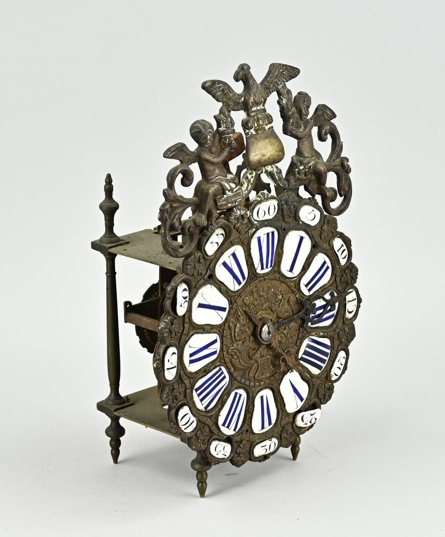 French lantern clock: Small 18th century French bronze lantern clock with verge escapement. Bell missing. One turret broken off. Not tested. Dimensions: 26 x 10 x 16 cm. In fair condition.