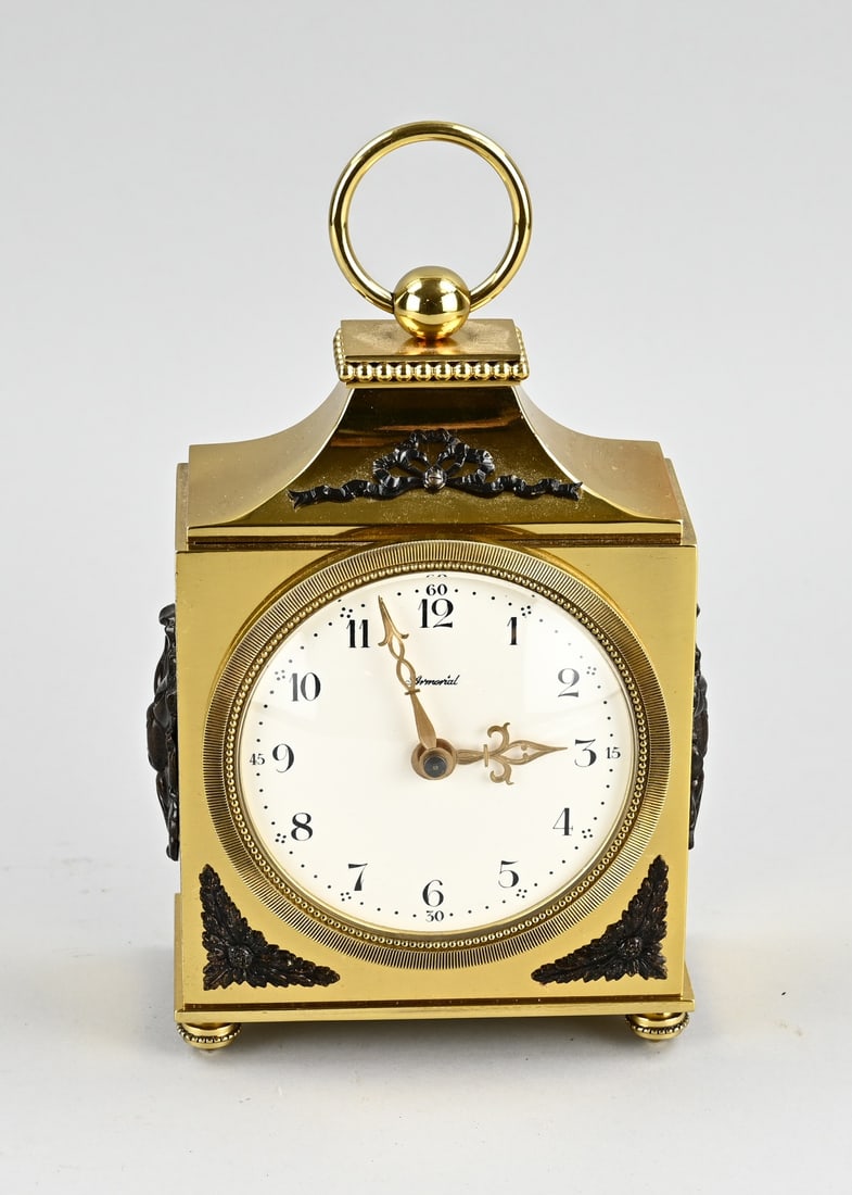 Officer's watch: Heavy bronze gilt officer's clock, Louis Seize style. Marked Amorial. Second half 20th century. Half hour strike on bell. Size: 21 cm. In good condition.