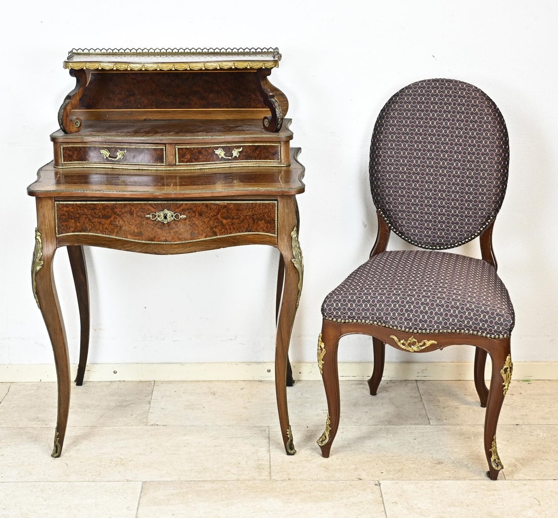 Ladies desk + chair: 19th century French ladies' desk with rosewood and burl walnut veneer. Desk is completely rimmed with brass. The large drawer has a writing area. The desk has a separate chair with bronze ornaments.