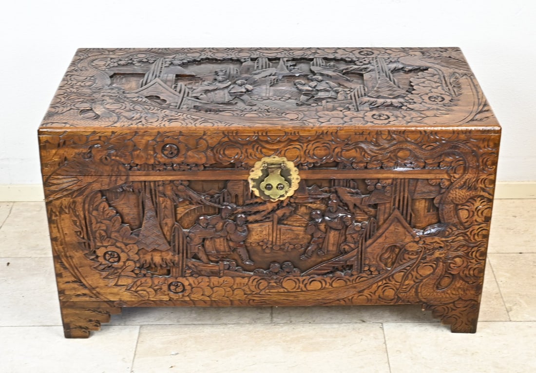 Indonesian camphor chest: Large Indonesian wood carved camphor chest with carvings all around. 20th century. Dimensions: 102 x 58 x 50 cm. In good condition.