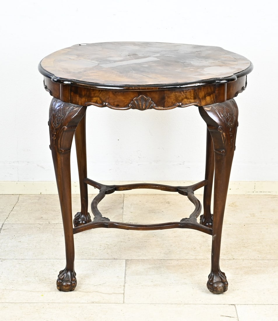 Side table (walnut) Ø 71 cm.: Walnut side table, queen Anne, with claw feet and the legs are connected to each other. Circa 1900. Dimensions: H 70 x Ø 71 cm. In good condition.