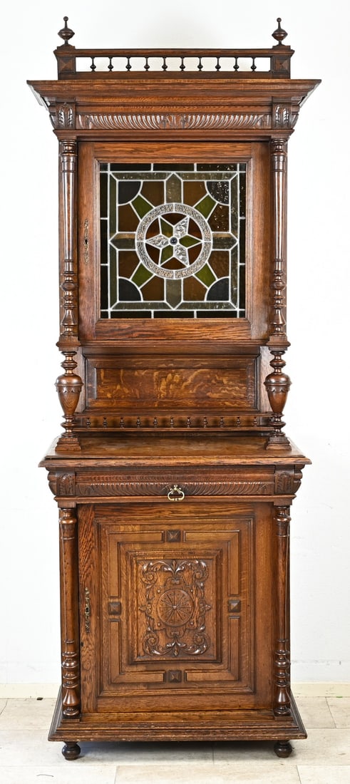 French sideboard, 1880: French, oak Henri Deux sideboard with full columns and stained glass door. Circa 1880. Dimensions: 240 x 90 x 55 cm. In very good condition.