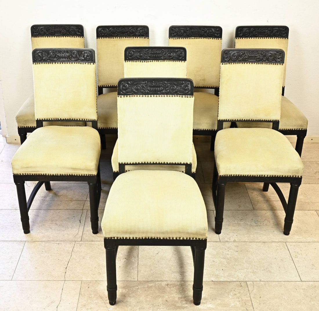 Set of 8 chairs, 1910: Set of eight antique Dutch oak chairs with flower vases carving. Circa 1910. Dimensions: 88 x 50 x 46 cm. In good condition.