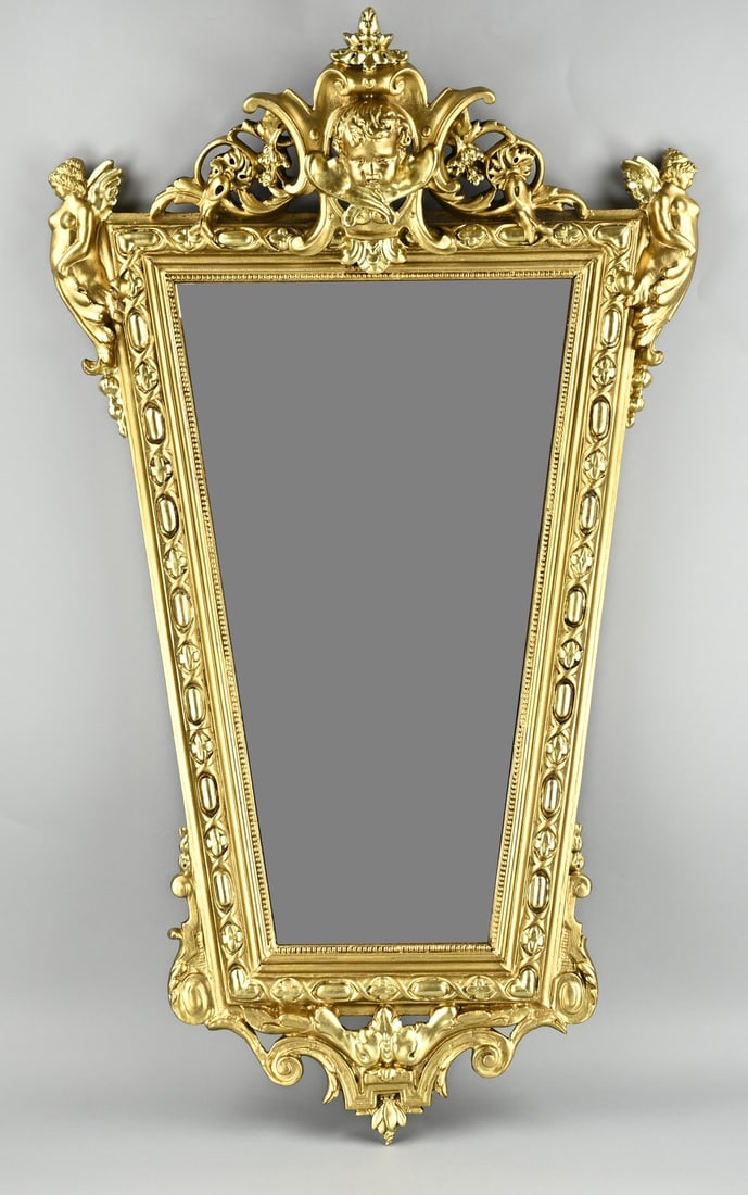 Gilded mirror, 107 x 60 cm.: Gilded German historicism mirror, with cherub head + angels. Circa 1880. Dimensions: H 107 x W 60 cm. Older restoration. Otherwise in good condition.