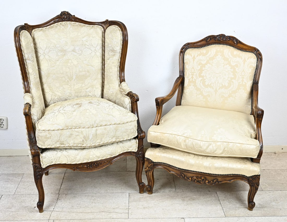 Two walnut armchairs: Two antique 19th century walnut armchairs. Professionally restored and upholstered. Dimensions: 120 x 70 x 75 cm. / 105 x 72 x 70 cm. In good condition.