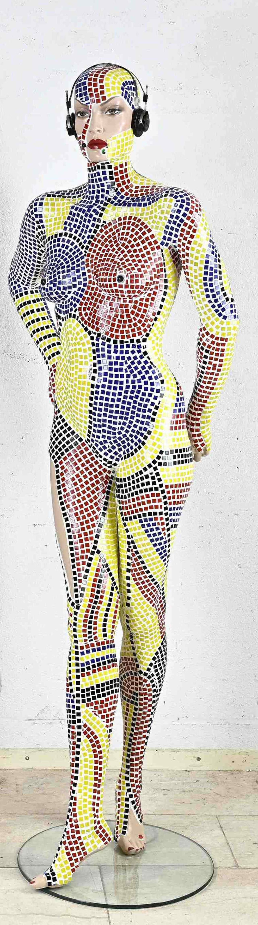 Mosaic mannequin pop art.: Life-size pop art female doll with headphones. Glued with mosaic ceramic, in the style of Damien Hirst. Second half of the 20th century. Dimensions: H 182 cm. In very good condition.
