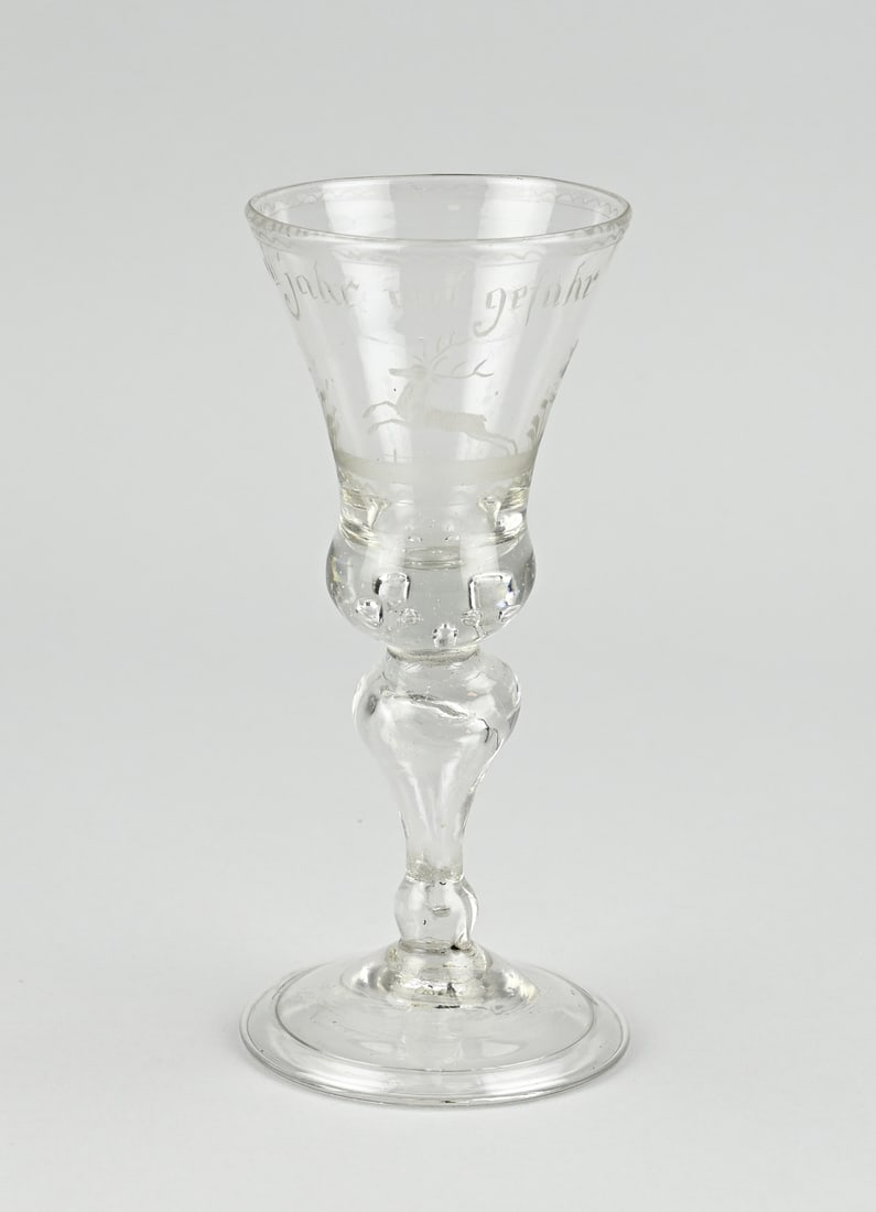Antique glass with saying, H 18 cm.: 18th century glass with motto and red deer engraved. 'Viel Jahr viel gefahr'. Size: H 18 cm. In good condition.