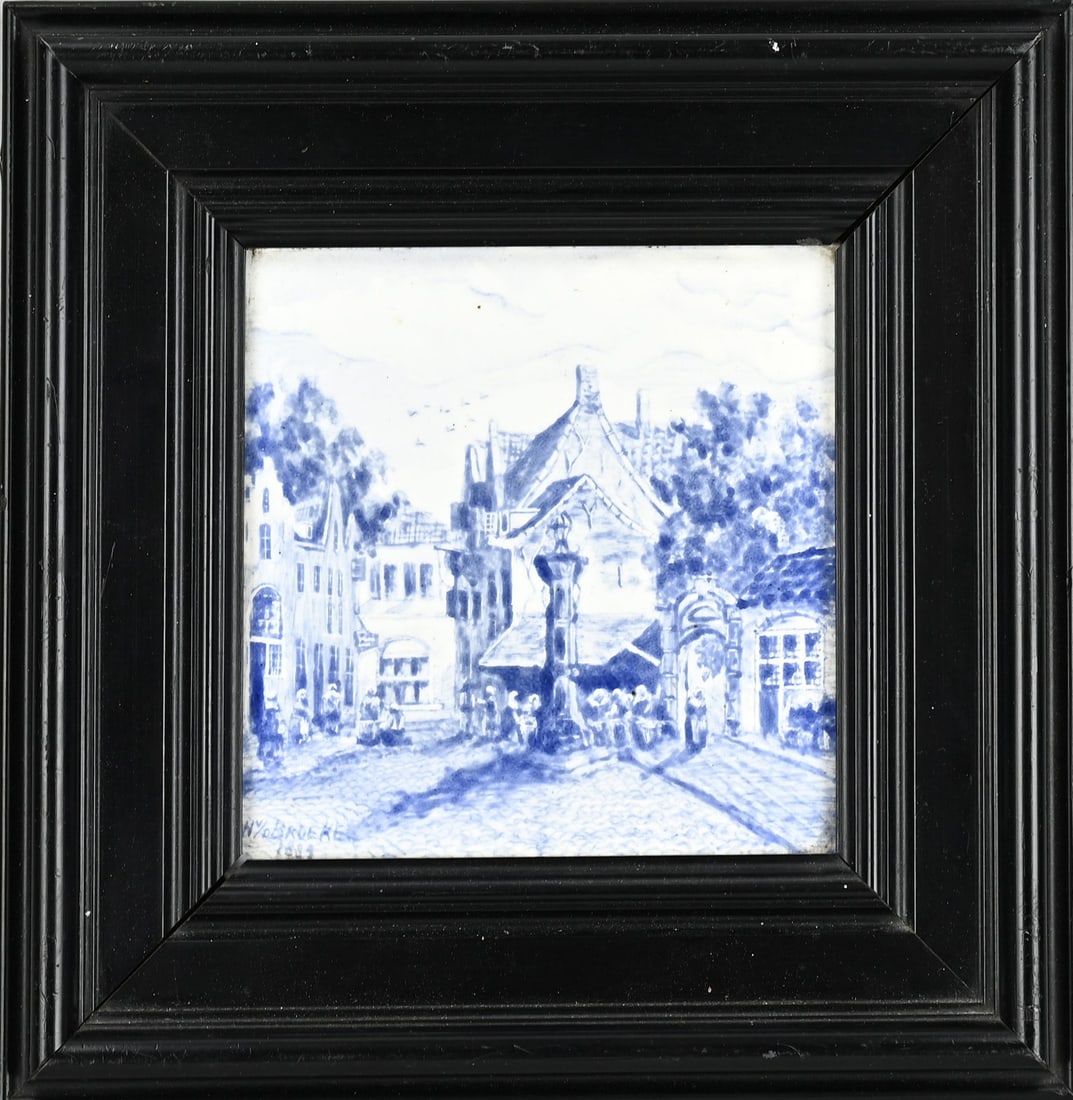 Tile in frame, 26 x 26 cm.: Antique Dutch tile in ebonised wooden frame. W. v/d Broeke 1889. Village square with figures. Size: 26 x 26 cm. In good condition.