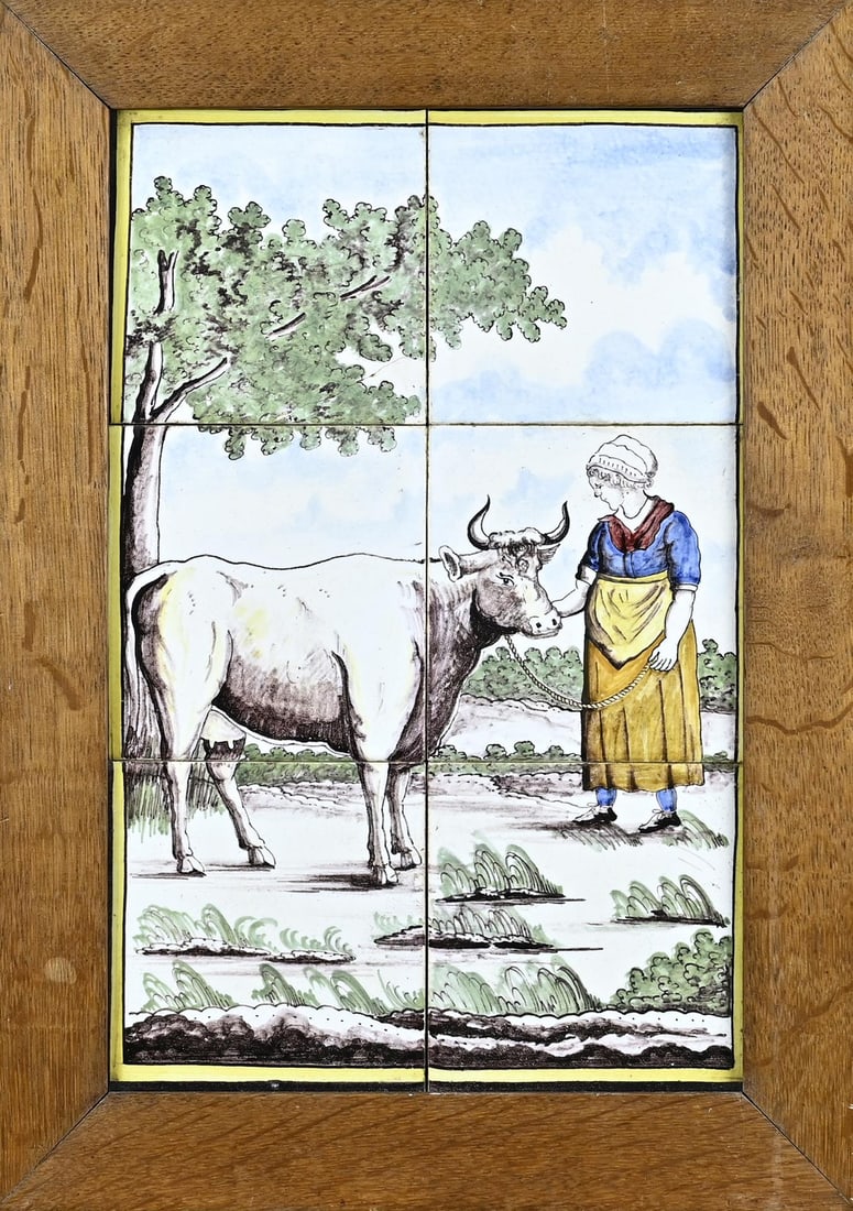 6-Pass tile tableau: 6-Pas 19th century polychrome painted tile tableau in oak frame. With image of farmer with cow. Circa 1880. One tile glued. Dimensions: 47 x 34 cm. In good condition.