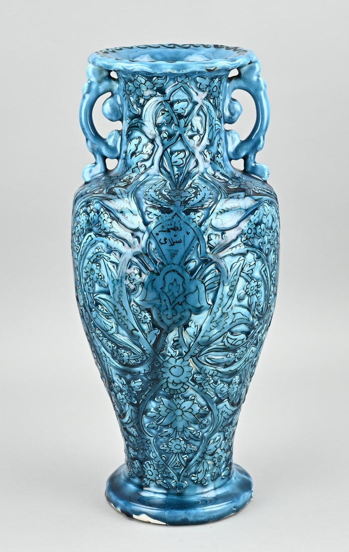 Chinese vase, (Persia): Antique Chinese celadon vase with handle made for the Persian market, with Persian inscription and floral relief decoration. Dimensions: H 44 cm. In good condition.