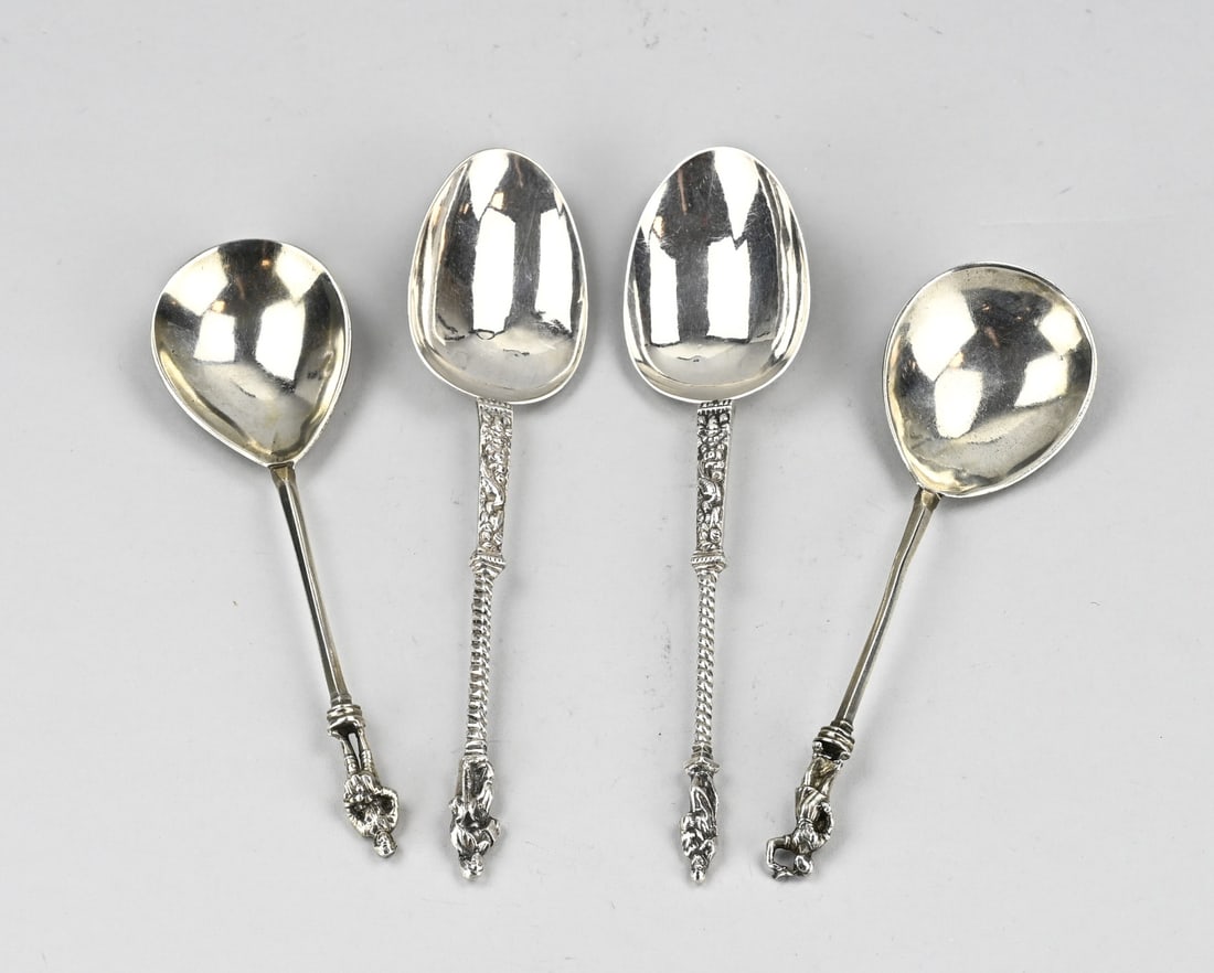 4 Silver spoons with figures: Lot with 4 spoons, two Groningen 833/000 silver apostle spoons. In between relief decoration with bird and twisted handle. Crowned with apostle. MT.: R.Scheltens-Groningen. And a pair of silver