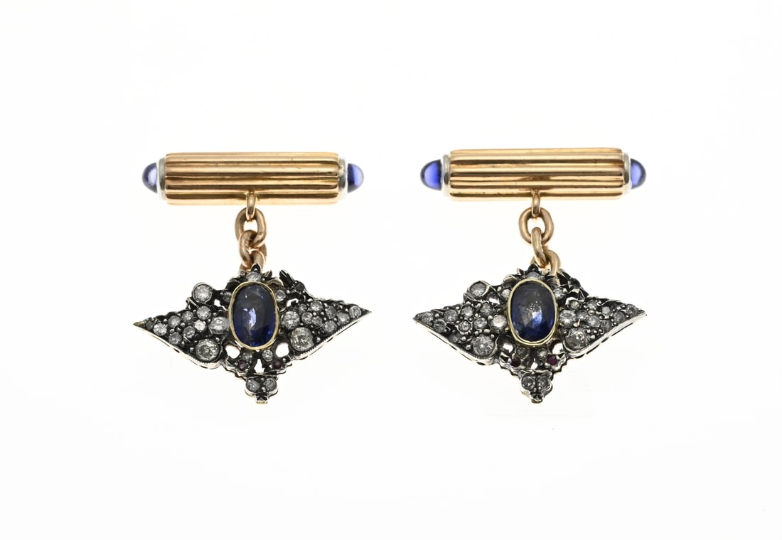 Romanov gold cufflinks: Beautiful yellow gold cufflinks, Romanov, 56 zolotniks, circa 19th century, in the shape of a stylized insect richly set with diamonds, rubies and an oval faceted blue sapphire. MT.: probably August H