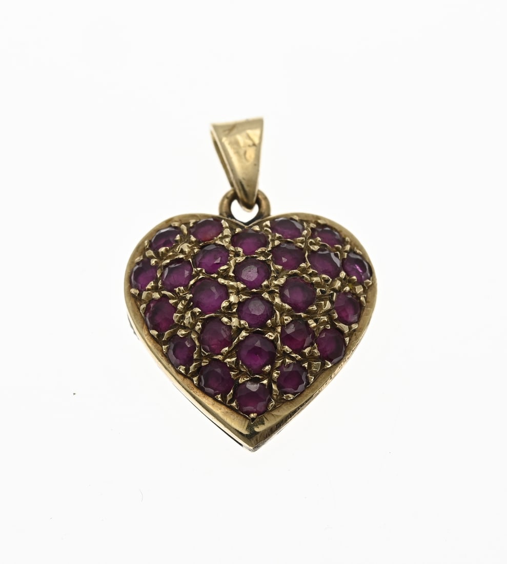 Golden heart pendant with ruby: Yellow gold pendant, 750/000, with rubies. Ball gold heart, pavé set with 25 round faceted ruby stones. Size 17x23.5 mm. including pendant eye. approx. 2.8 grams. In good condition.