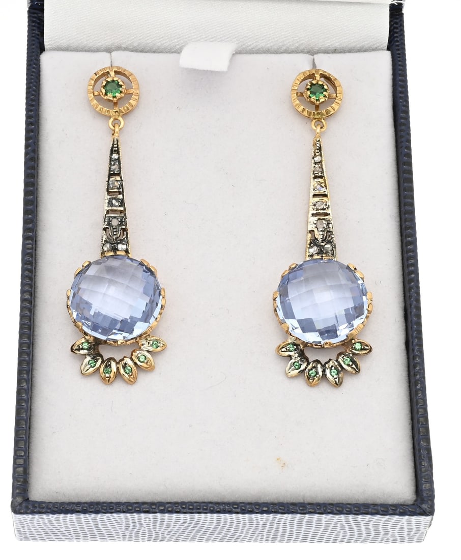 Earrings with colored stones: Elegant earrings, 375/000, rose with diamond, emerald and light blue stone. Stud earrings with a round openwork button set with an emerald and a long pendant with 7 diamonds with an old cut,