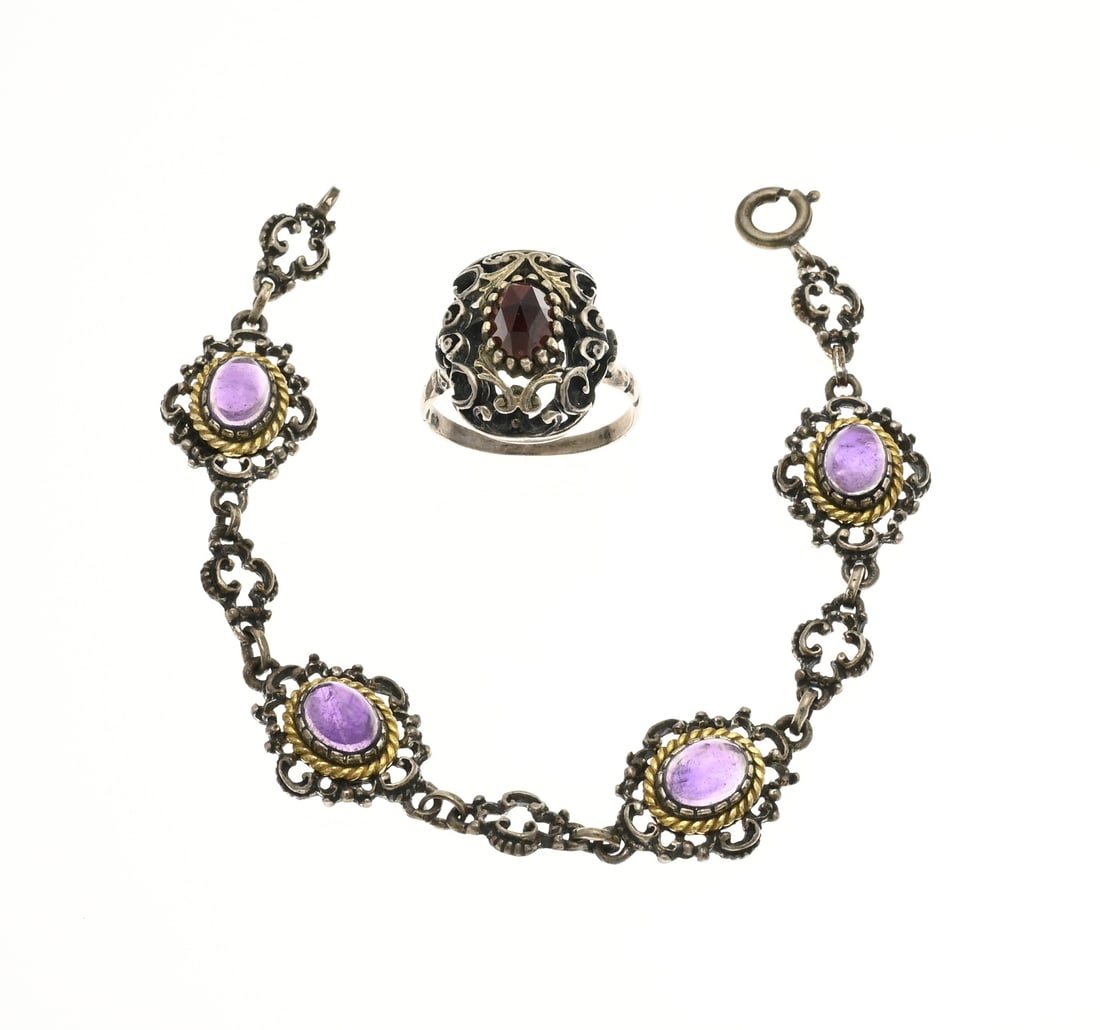 Silver ring and bracelet with purple stone and garnet: Silver bracelet and ring, 835/000, with garnet or agate. Bracelet with oval openwork links with oval purple stones in a gold-plated edge. Width 15 mm. and an openwork ring with an oval faceted garnet