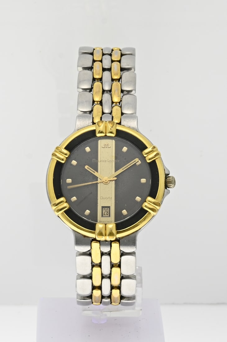 Maurice Lacroix watch: Maurice Lacroix Calypso, unisex, bicolour model with a gold-plated bezel with black edge. The watch features a date display. The watch has a steel strap with gold elements. ref. no.: 95327. ø case