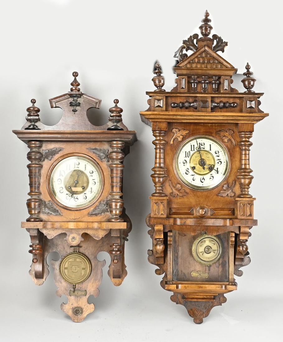 2x Free-swing clocks.: Two antique German walnut Grunderzeit free-swinging wall clocks, circa 1890. Both are weekly clocks with half-hourly chimes. Approximately 85 and 70 cm in length, they are in reasonably good condition