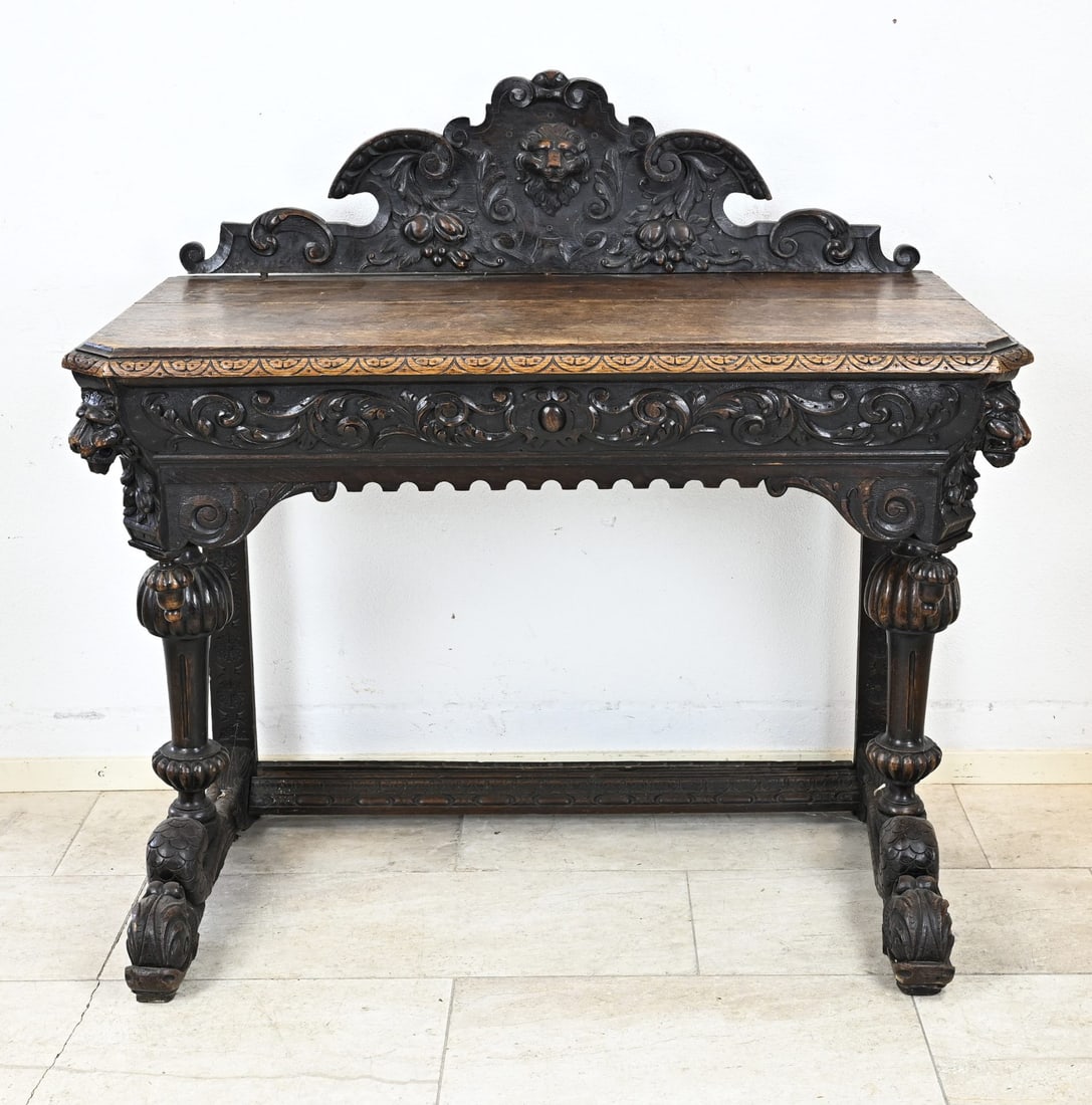 Console table (dolphins): 19th-century French oak carved Neo-Renessance console table/wall table with lion heads on dolphins. Circa 1870, in good condition. Dimensions: 120x57x118 cm.