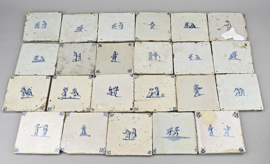 Lot of tiles (23x), Children's games: 23 Dutch faience tiles with various children's games. 18th century. Some damage. Dimensions: 13 x 13 cm. In good condition.