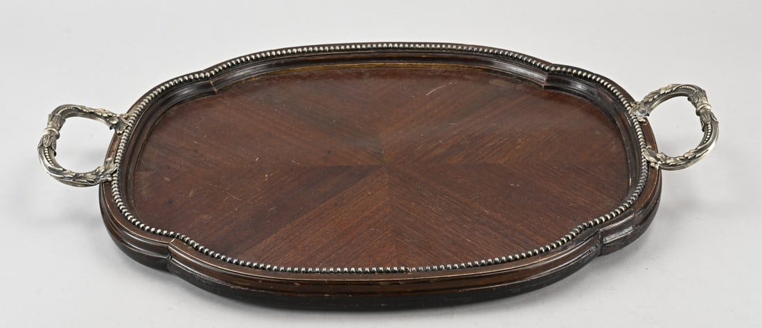 Tray with silverware: Beautiful wooden serving tray, oval contoured model, decorated with a silver beaded rim and handles with acanthus leaves. 54x35cm. The underside is lined with burgundy felt. Some wear and damage to