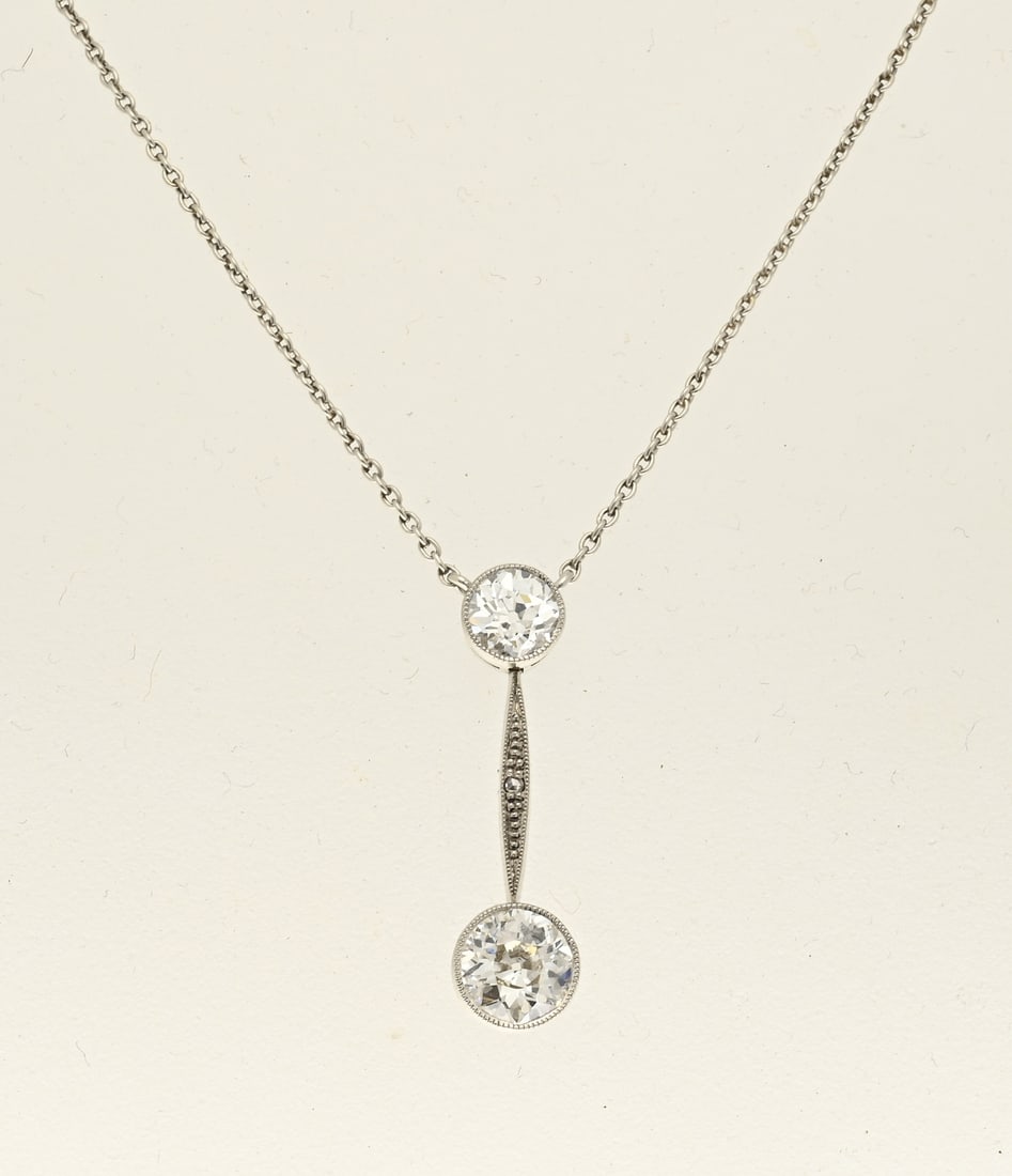 Choker with diamonds: Substantial white gold choker featuring a delicate anchor chain with a central round element containing a brilliant-cut diamond, approx. 0.70 ct., a bar-shaped element, and below that a round setting