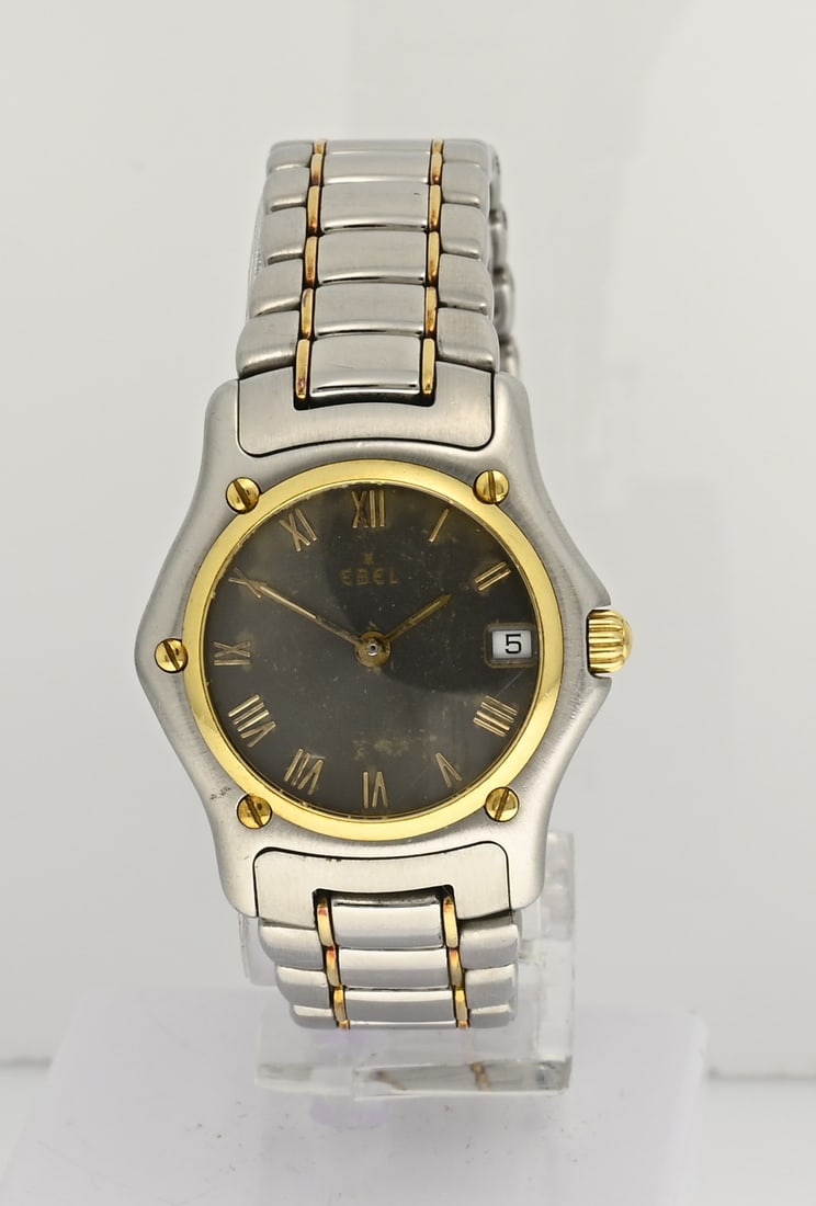 Ebel Lady watch 1911: Ebel watch, Lady model 1911, steel with gold, quartz, fitted with a grey dial with date display. Case width ø 25 mm. Case numbers: 72605670 188901. Mounted on a steel and gold band. Length approx.