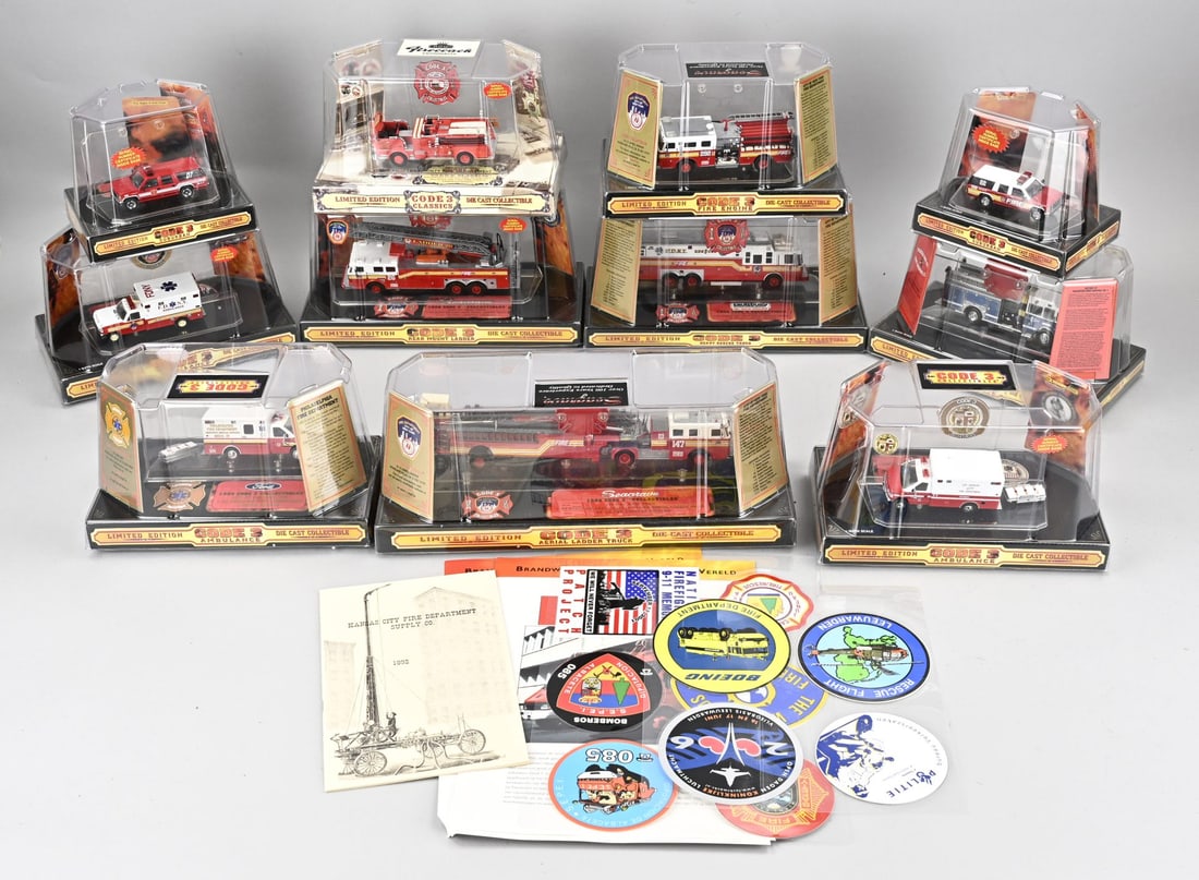 Lot of 11 scale model fire trucks Code 3: Lot of eleven fire trucks in display packaging from the brand Code 3 Limited Edition Diecast Collectible. All in good condition.