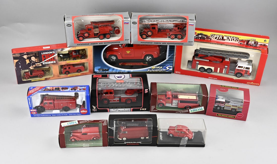 Lot of 12 scale model fire trucks: Lot of twelve diverse scale model fire trucks, from various brands, including; Sika, Vitesse, Solido, Majorette, et cetera. All with original packaging. In good condition.