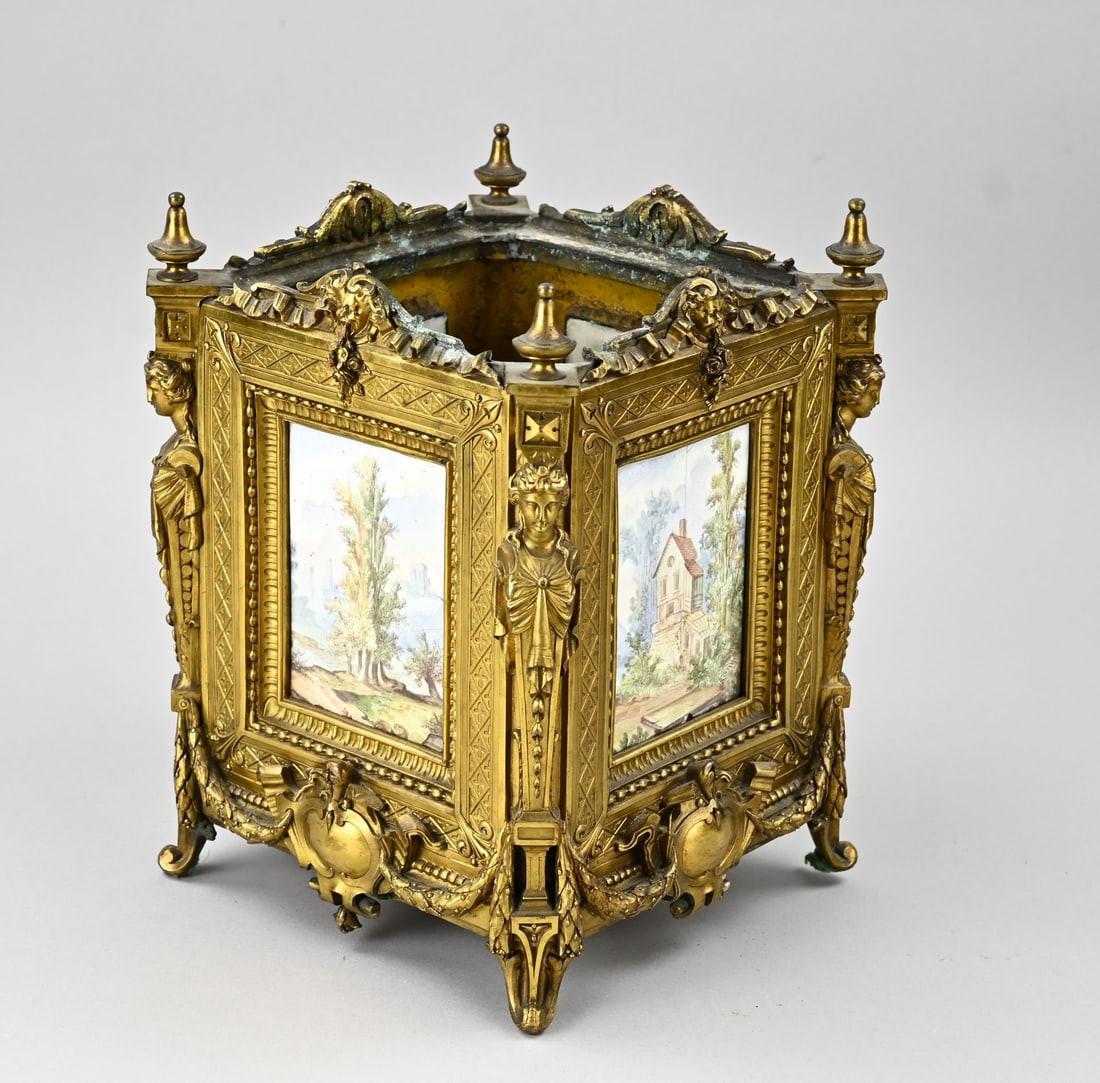 Gilded holder with plaques, 1870: Heavy, 19th-century gilded bronze holder with various hand-painted plaques and caryatids. Circa 1870. Napoleon III. (Christoffle & Cie. ?) Dimensions: 27.5 x 21 x 21 cm. In good condition.