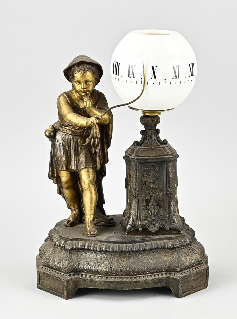 Tournant night clock with figure: Antique, French, Tournant night clock. Circa 1900. Bronze-colored composite metal. Dimensions: 32 x 22 x 17 cm. In good condition.
