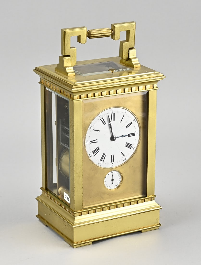 Rare large travel alarm clock: Antique, rare large, gilded bronze travel alarm clock. France. Circa 1900. Striking mechanism with three hammers on a gong spiral (quarter-hour strike). With a lower switch for three striking melodies