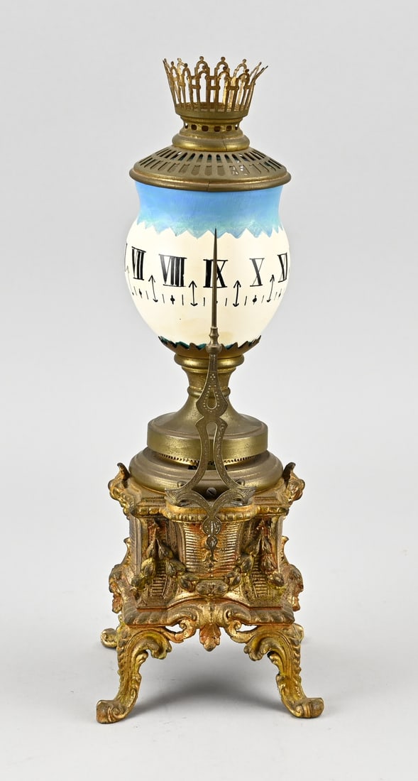 Tournant night light clock, H 34 cm.: Antique French Tournant night light clock with gilded composite metal. Circa 1900. Dimensions: H 34 cm. In good condition.