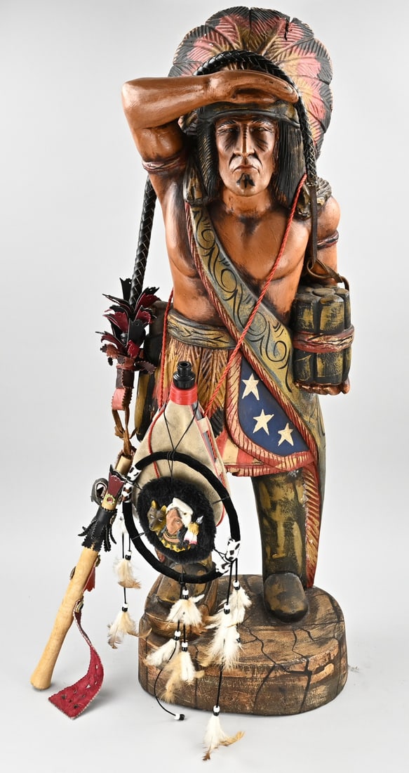 Wood-carved figure, Native American: Large carved wooden USA Native American with leather whip, canteen, and dreamcatcher. Dimensions: 99 cm. In good condition.