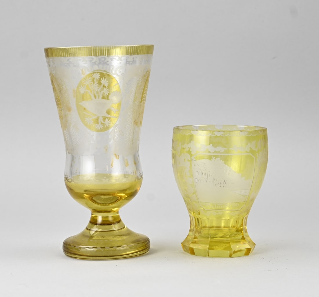 2x Bohemian glass goblet: Two antique crystal glasses + engraved cups, Bohemian. Amber colour. 1x Large with hunting motifs. 1x Small with castles, Johannisberg, Rolandseck Rheinstein. Dimensions: 13 - 22 cm. In good condition