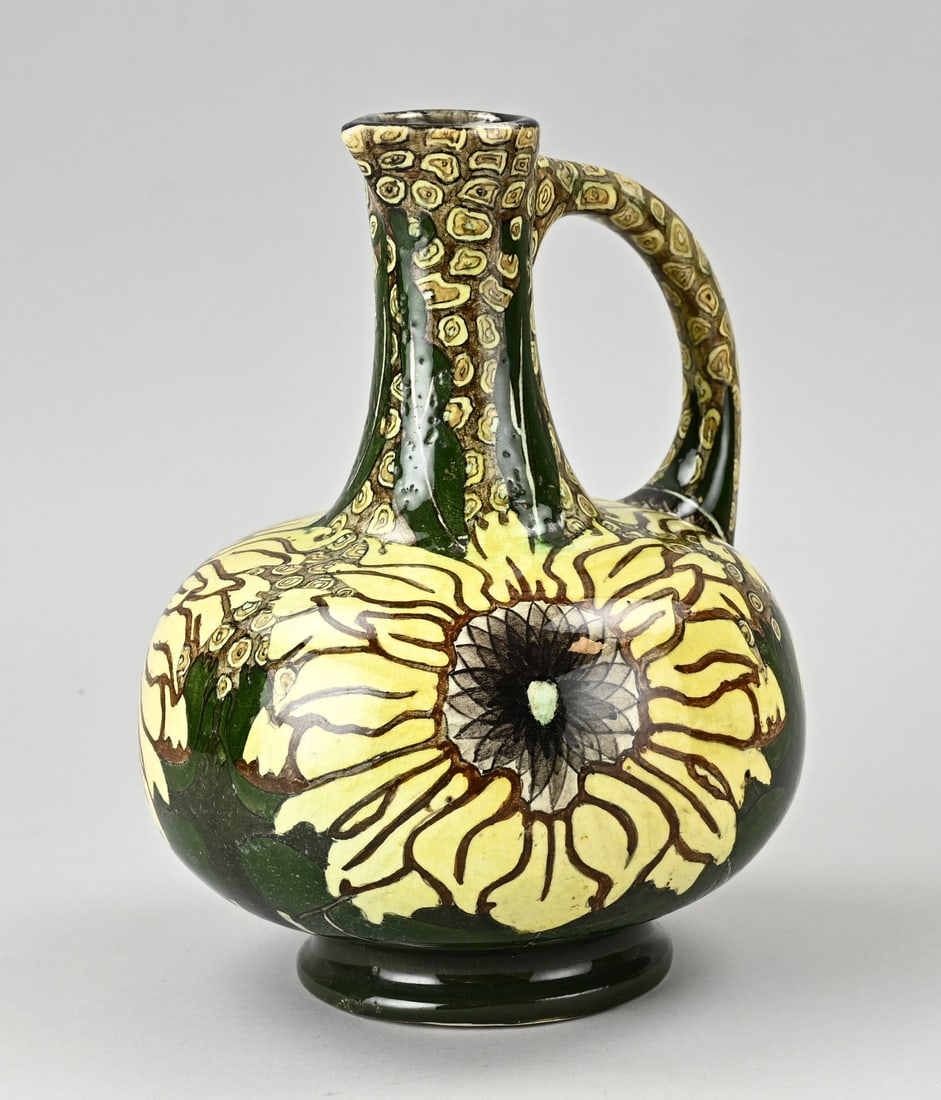 Purmerend pitcher, H 24 cm.: Antique Dutch polychrome earthenware Art Nouveau jug with floral decoration. Purmerend, Holland. Circa 1900. Various base marks + painter's monogram. No. 1025. Dimensions: H 24 cm. In good condition.