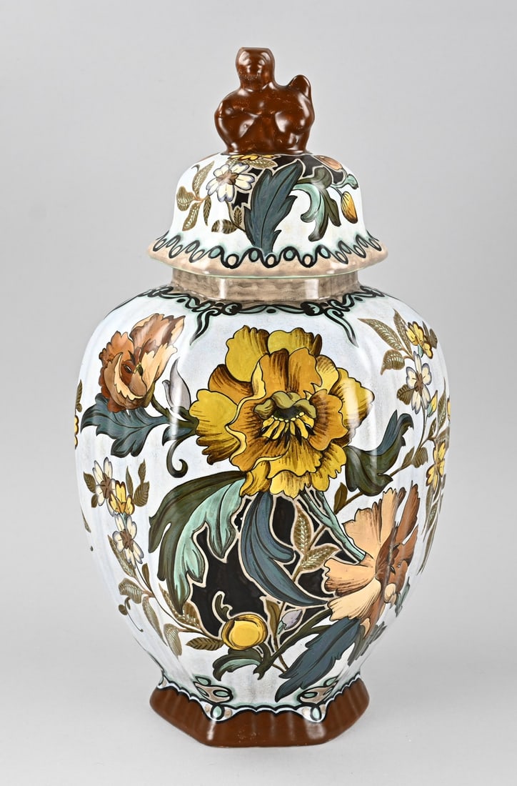 Gouda earthenware lidded vase, 1910: Antique polychrome earthenware South Holland Gouda lidded vase with floral decoration. Art Nouveau. Circa 1910. Dimensions: H 51 cm. In good condition.