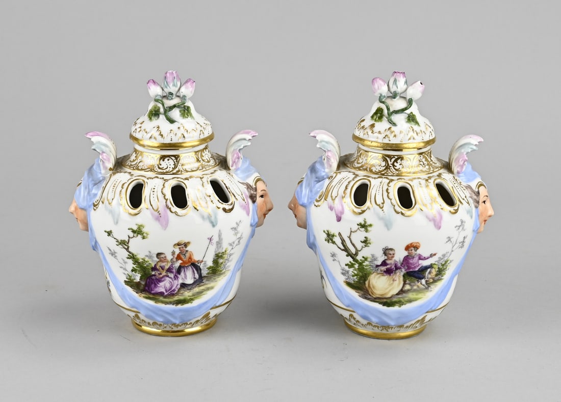 2x KPM potpourri lidded vase Ø 9.5 cm.: Two antique porcelain KPM potpourri lidded vases. Hand-painted with figures/floral and gold decoration. Germany. Circa 1900. Dimensions: H 15 x Ø 9.5 cm. In good condition.