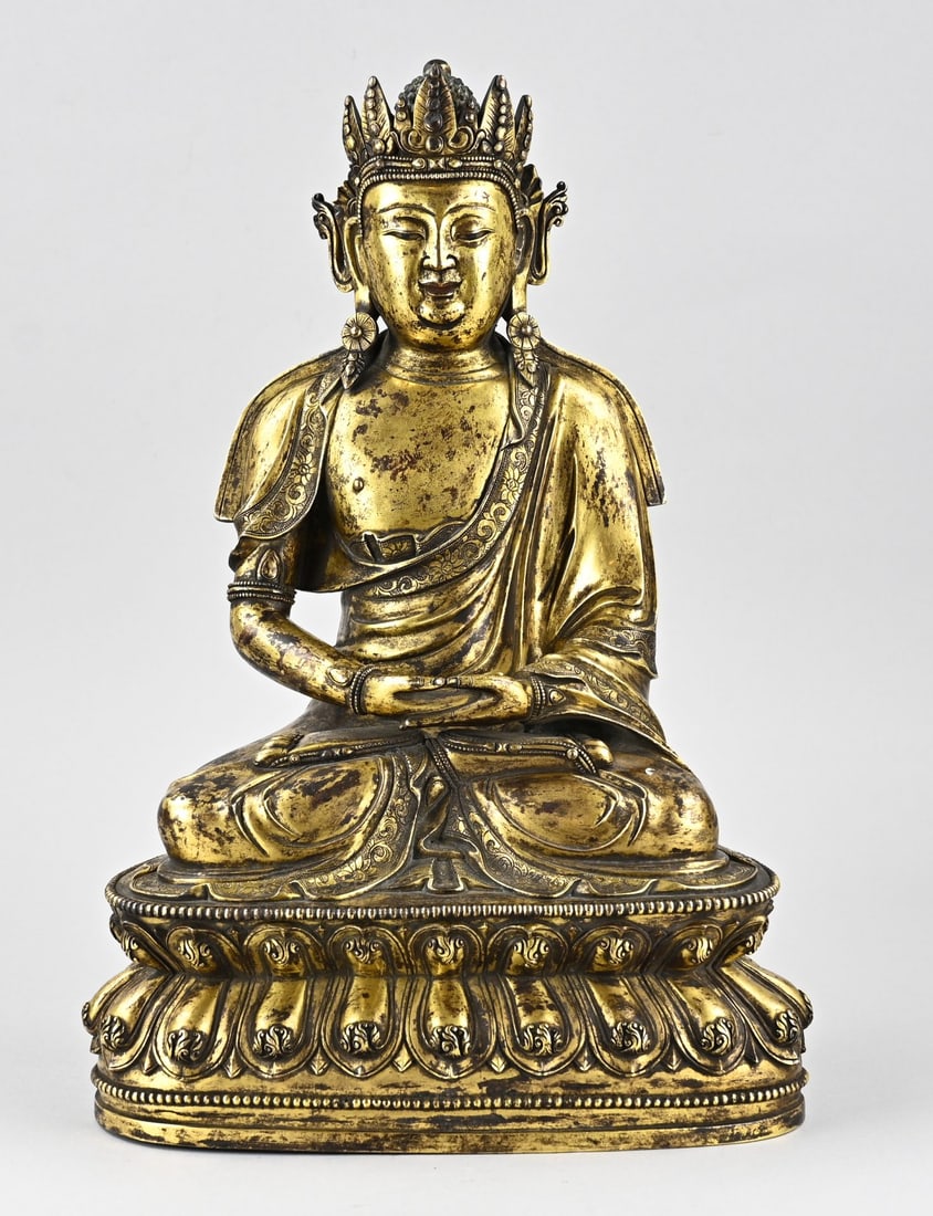 Bronze gilded Buddha, H 39.8 cm.: Antique and heavy Chinese bronze Buddha, seated on a lotus flower. With floral base mark. Beautifully detailed workmanship. Qing Dynasty. Dimensions: H 39.8 cm. In good condition.
