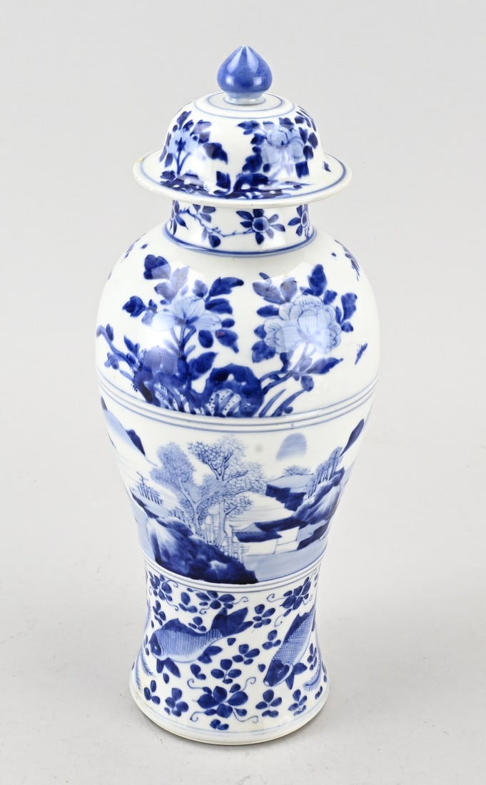 Chinese lidded vase, H 35 cm.: Chinese porcelain Kang Xi lidded vase with landscape/fish and floral decoration. 17th - 18th century. With base mark. Vase intact. Lid chipped, rim glaze damage. Dimensions: H 35 cm. In fair/good cond