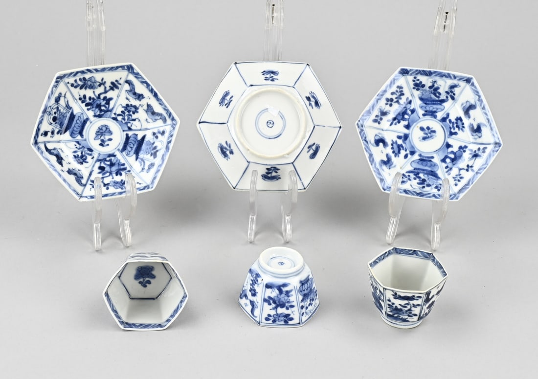 Lot of Chinese porcelain: Three 17th-18th century Chinese porcelain cups and saucers. Hexagonal. With floral/chicken and flower vase decoration. With base mark. Two saucers chipped, one saucer in good condition. One cup in goo