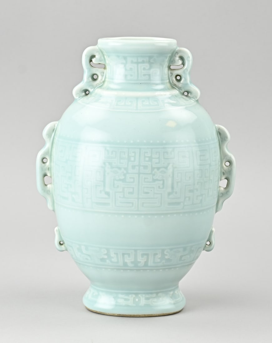 Chinese celadon vase, H 23 cm.: Chinese porcelain celadon vase with meandering decoration all around. With base mark. Dimensions: H 23 cm. In good condition.